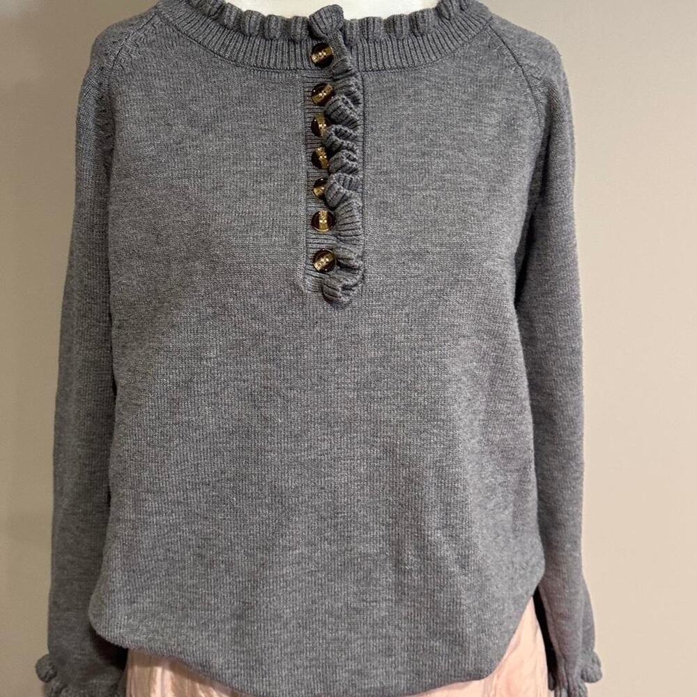 Grey button up sweater with buttons and ruffle detail